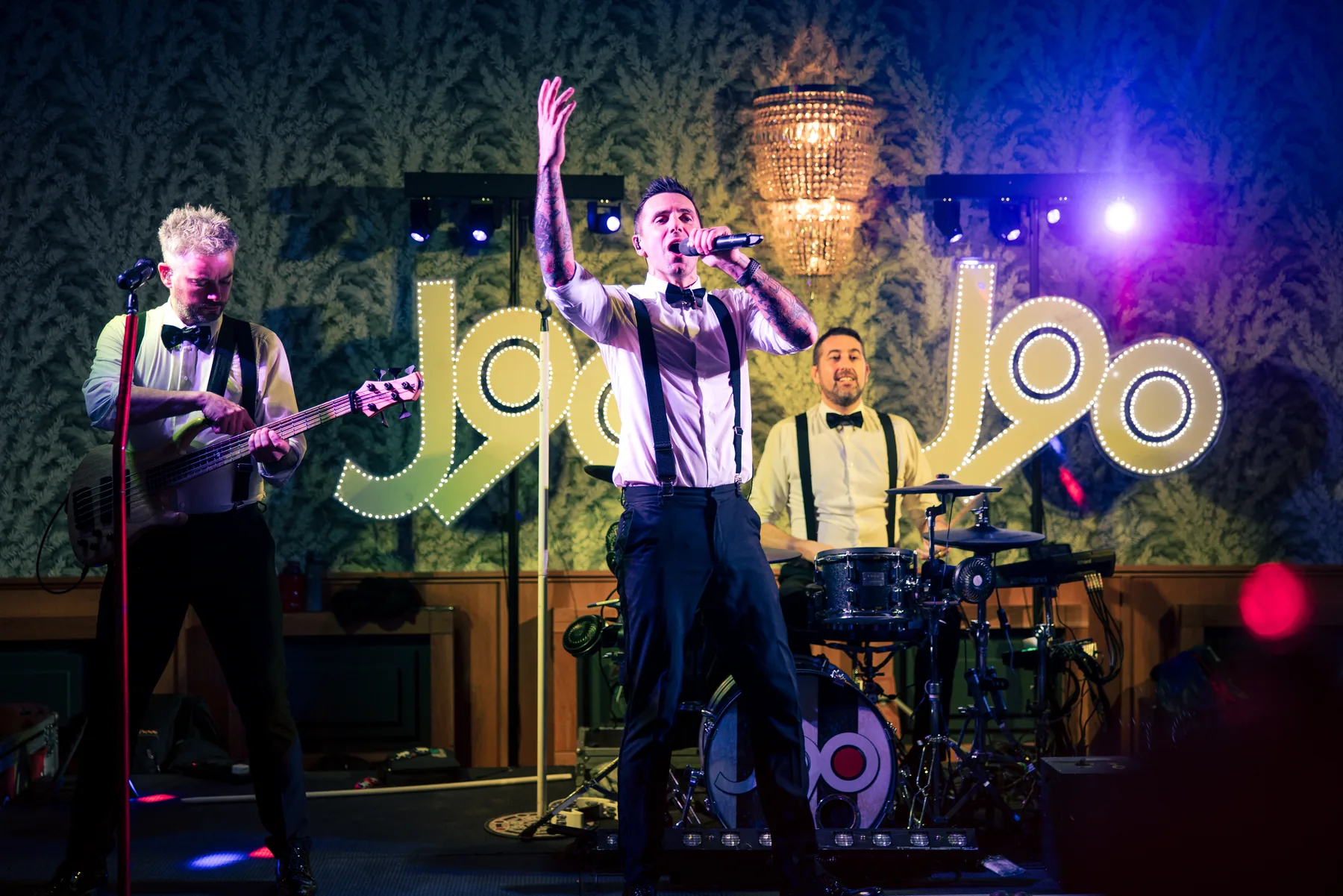 J90 wedding band performing on stage